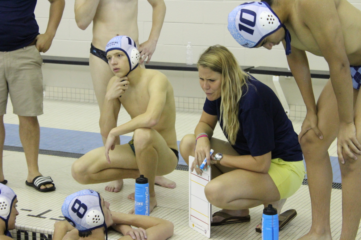 Water polo coach training athletes