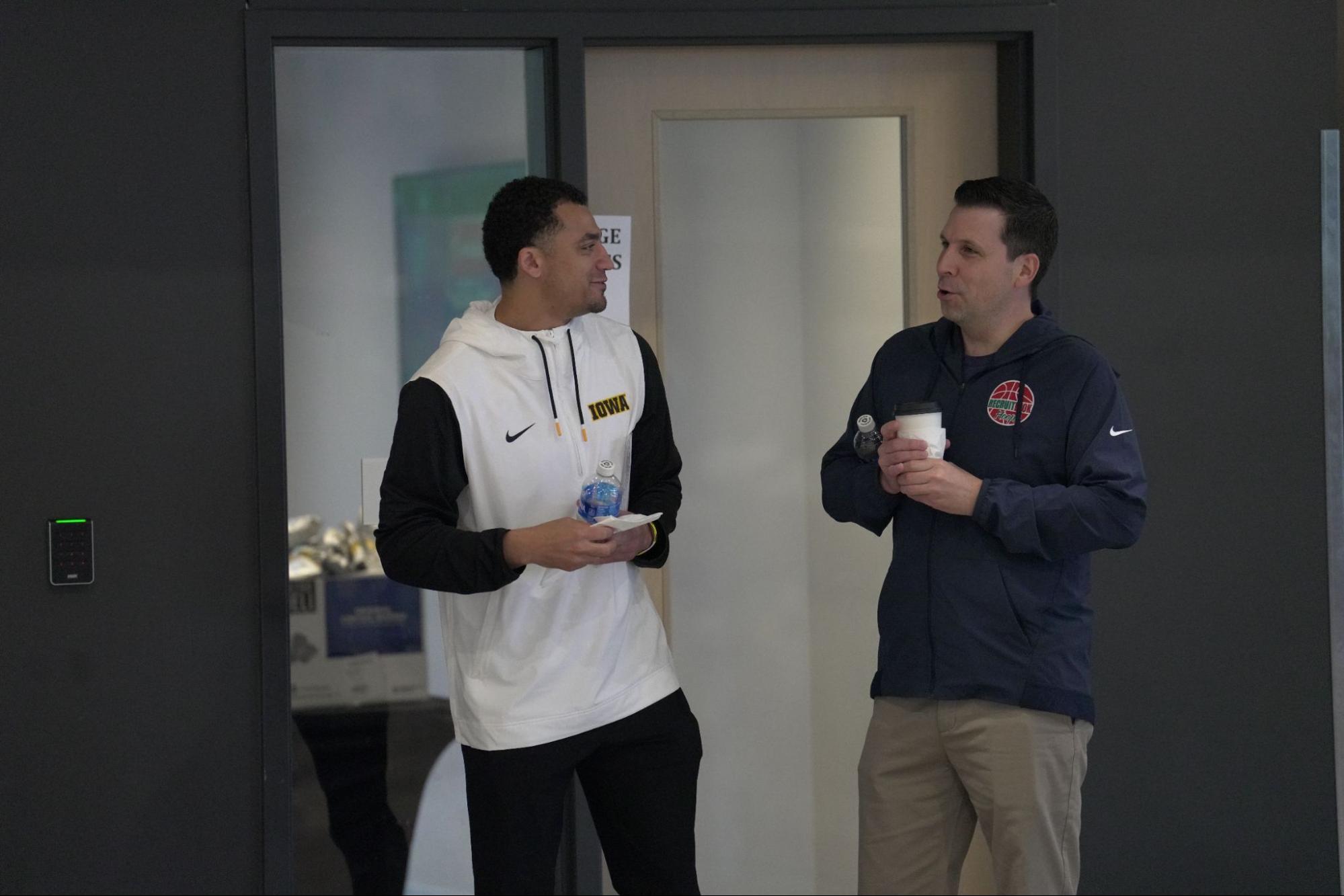 Mike Enright and coaching staff discussing recruiting strategy